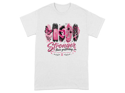 White t-shirt with "Stronger than yesterday" text and breast cancer awareness symbols.