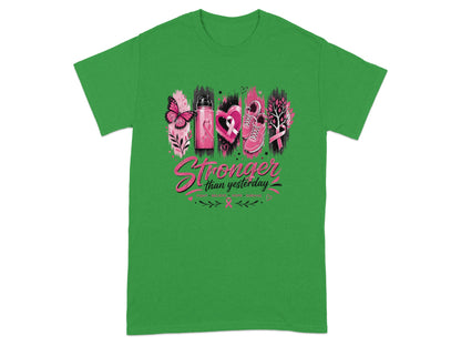 Green t-shirt with "Stronger than yesterday" and breast cancer awareness graphics.