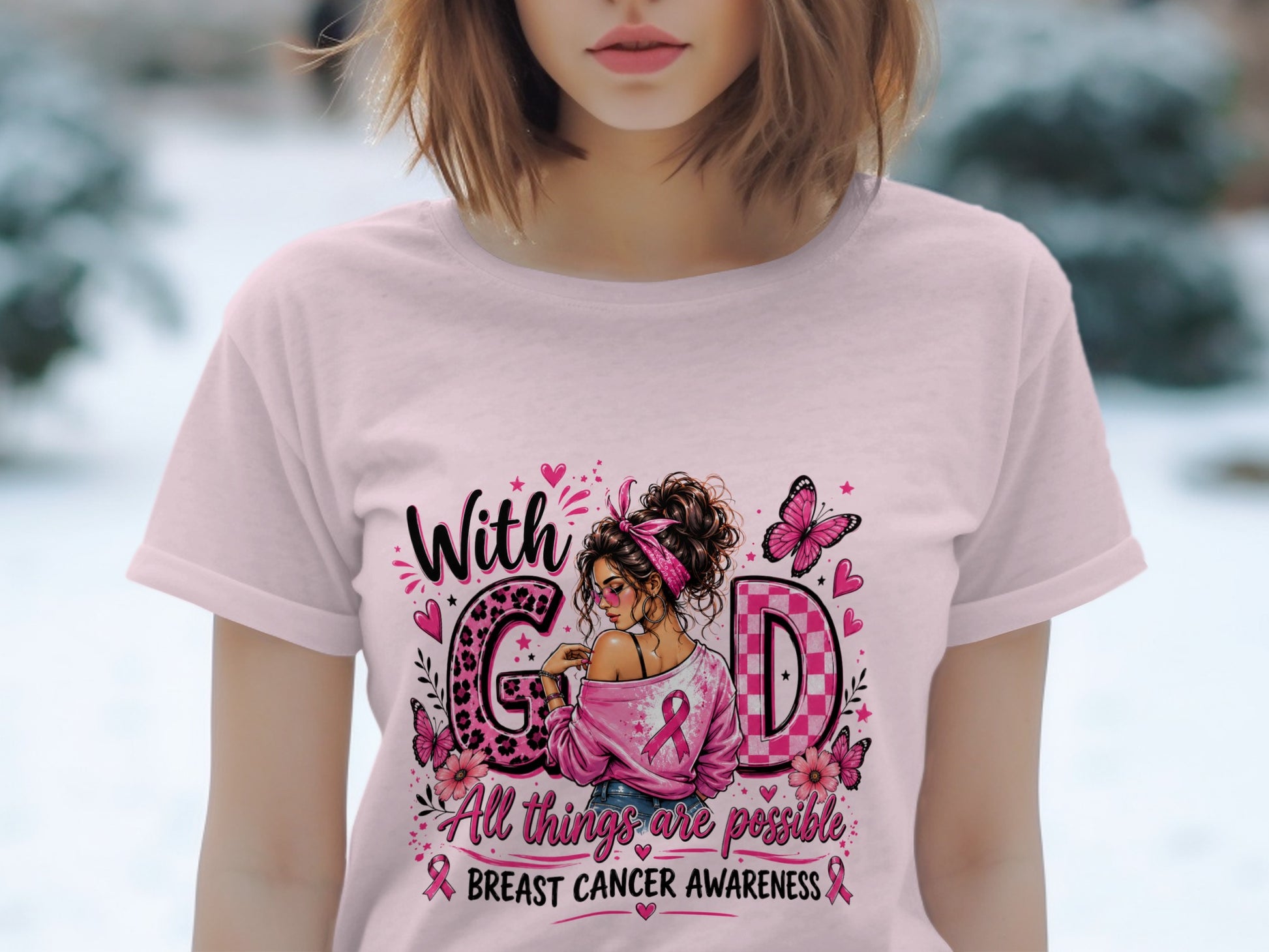 Pink t-shirt with "With God" and breast cancer awareness graphic.