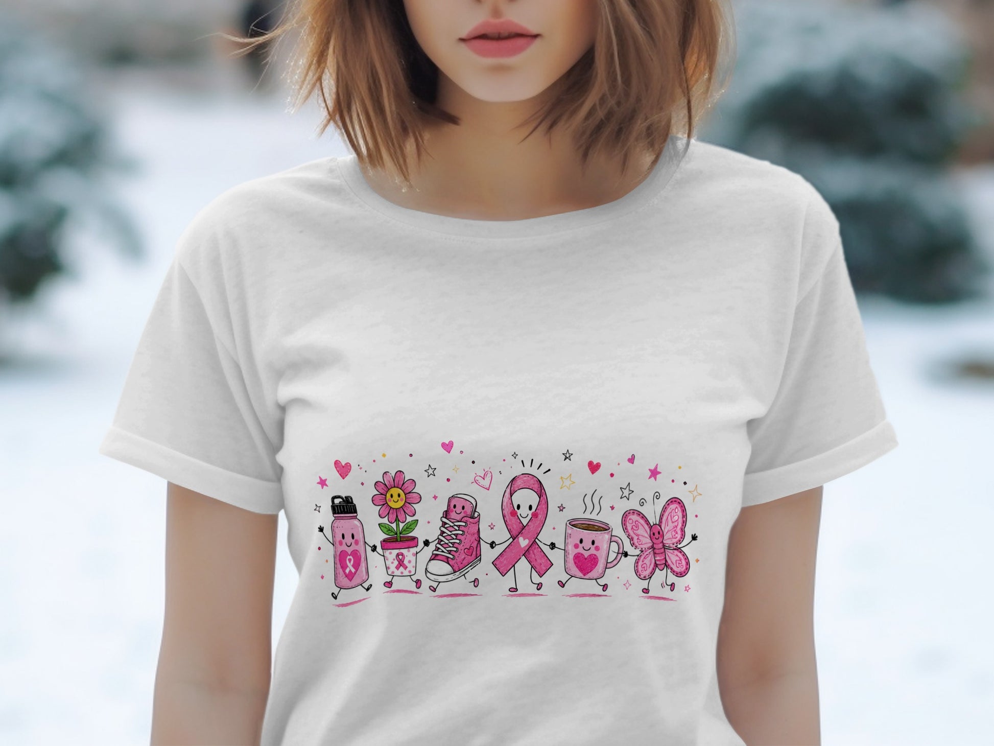 White t-shirt with pink cartoon breast cancer awareness ribbon, flower, shoe, mug, and butterfly.