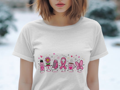 White t-shirt with pink cartoon breast cancer awareness ribbon, flower, shoe, mug, and butterfly.
