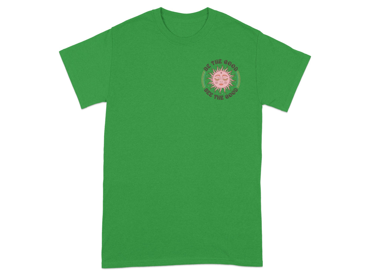 Green t-shirt with pink sun graphic and text "Be the good, See the good".