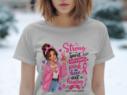 Girl with pink cardigan and text "Strong in spirit, soft in heart, pink for hope, art for healing."