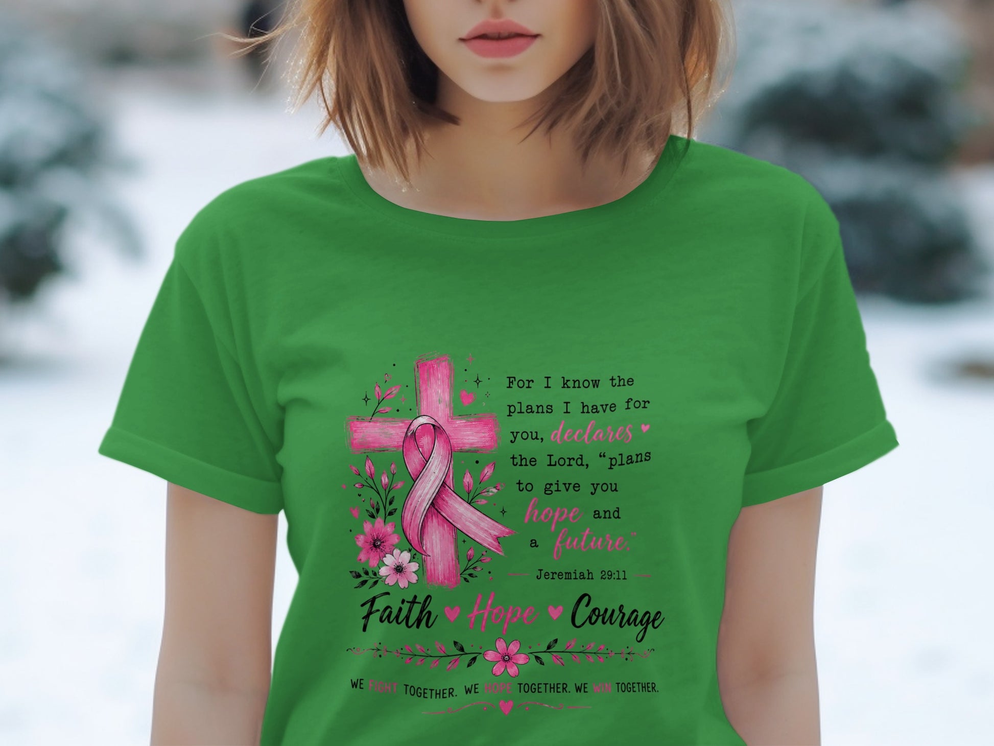 Green t-shirt with pink ribbon, cross, flowers, and inspirational text about hope.