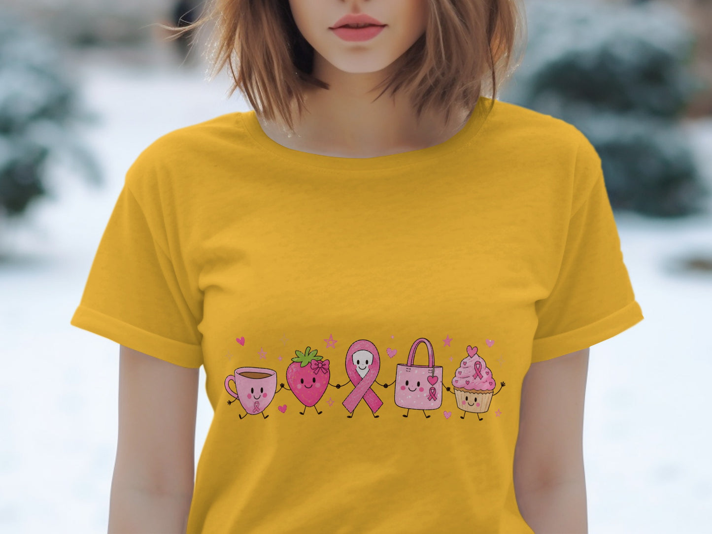 Yellow t-shirt with cartoon coffee cup, strawberry, ribbon, bag, and cupcake.