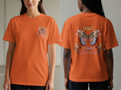 Orange t-shirt with a butterfly graphic and the words "TRUST YOUR VISIONS".