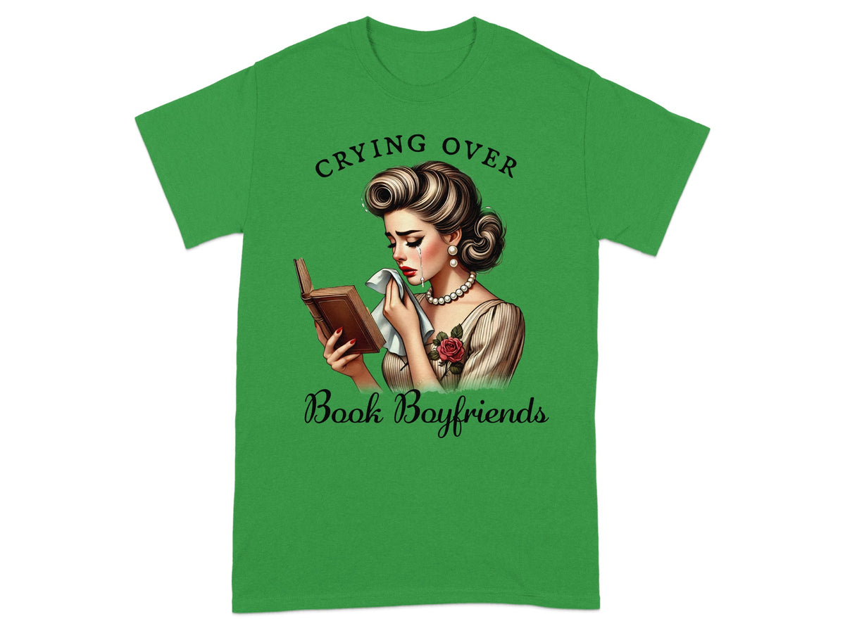 Green t-shirt with illustration of a woman crying over a book, text "Crying Over Book Boyfriends".