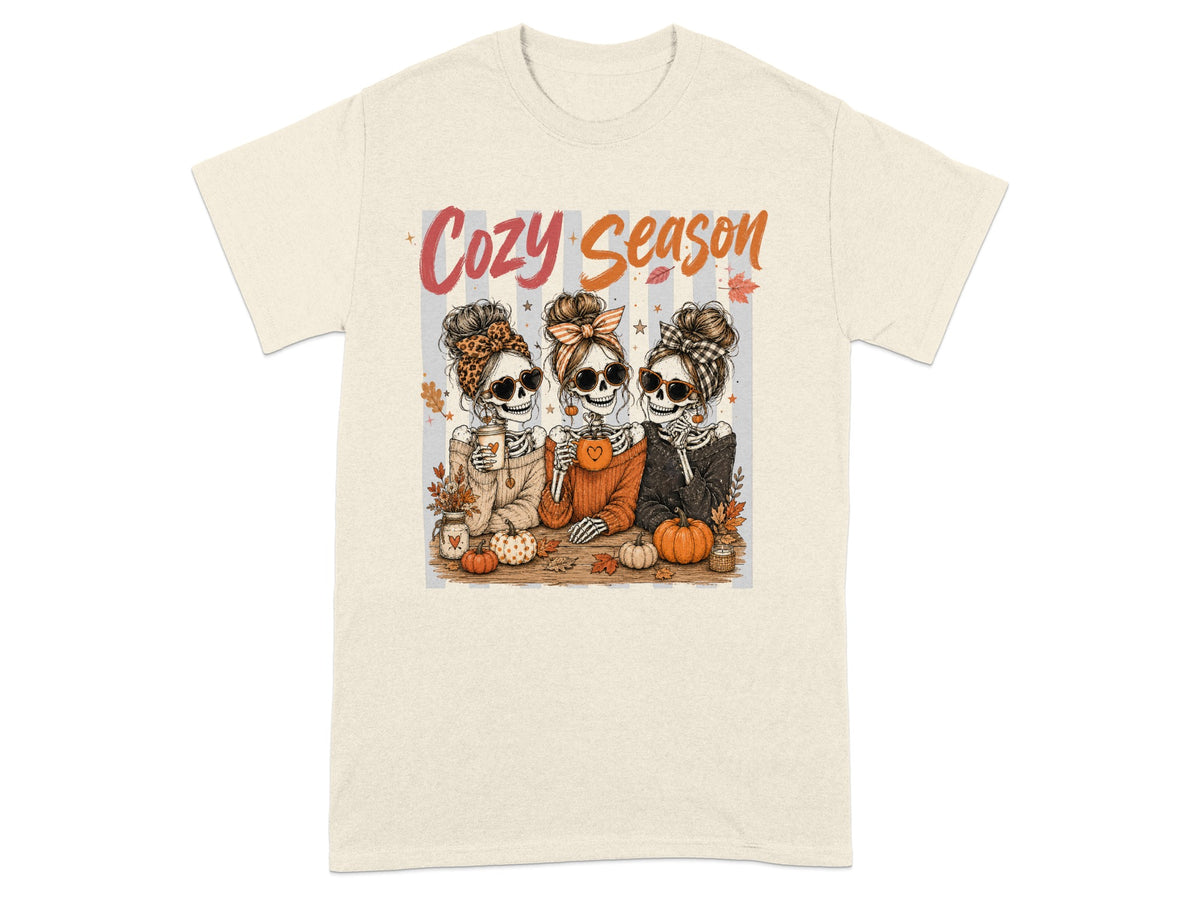 Three skeletons in sweaters and sunglasses with "Cozy Season" text and autumn decor.