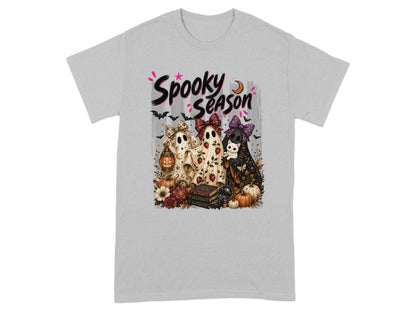 "Spooky Season" text with three ghosts, pumpkins, and bats on a t-shirt.