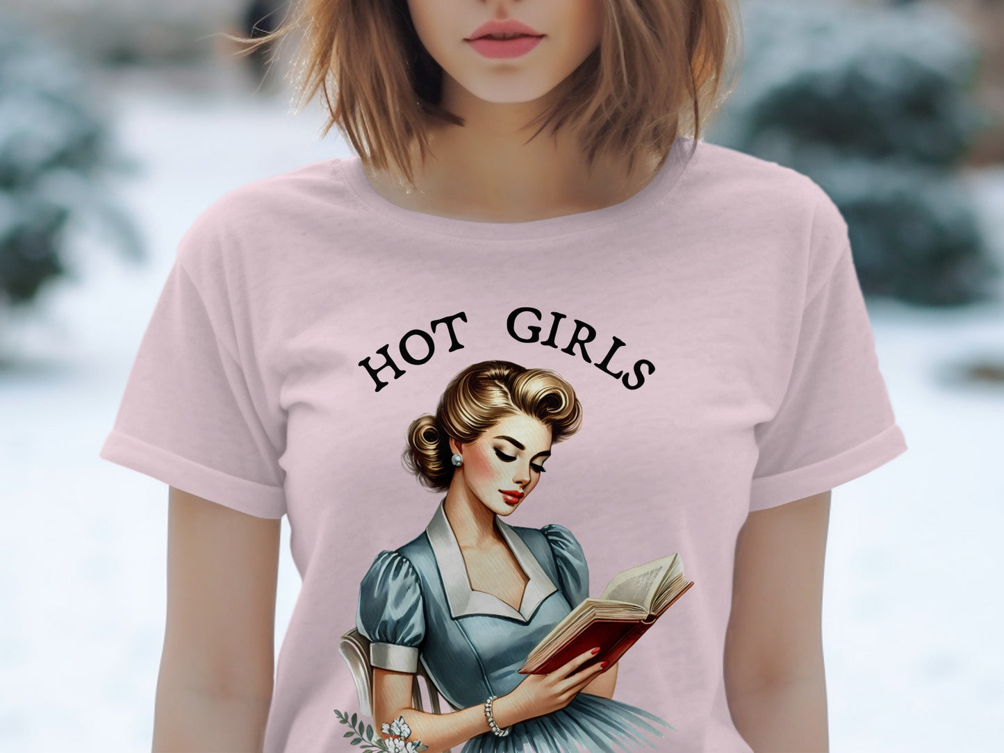 Pink t-shirt with "HOT GIRLS" text and vintage woman reading book graphic.