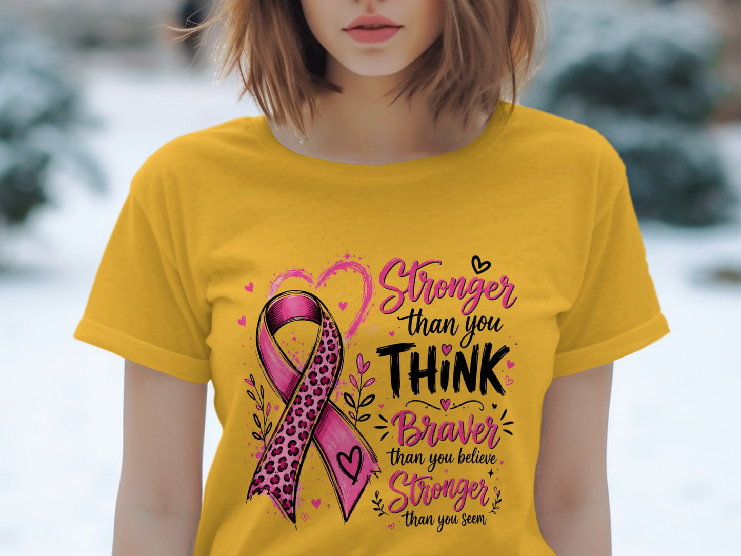 Yellow t-shirt with pink ribbon and text "Stronger than you THINK Braver than you believe Stronger than you seem."