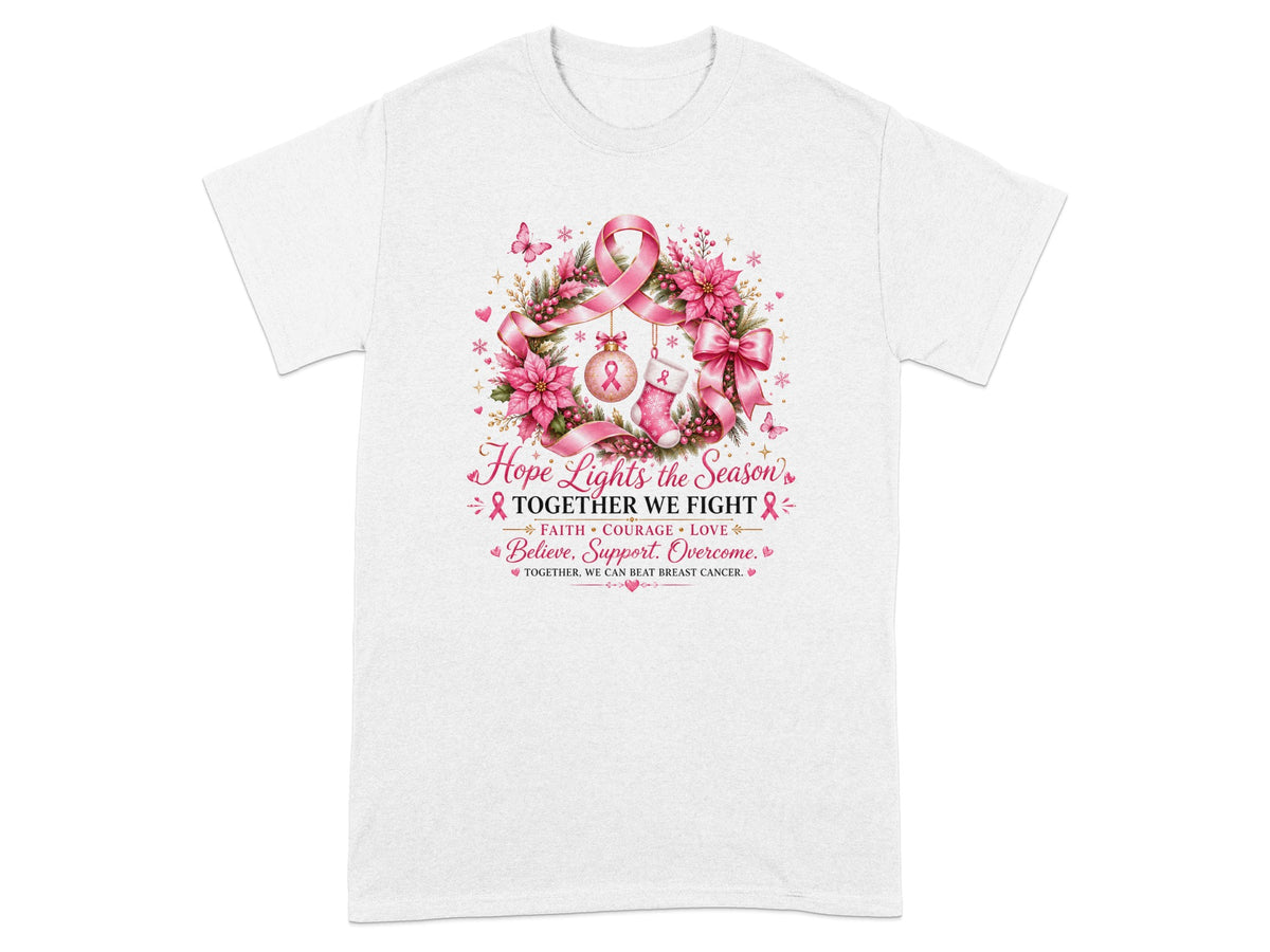 White t-shirt with wreath, pink ribbon, ornament, stocking, and text about fighting breast cancer.