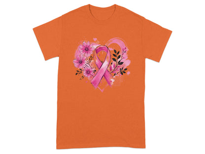 Orange t-shirt with pink ribbon, flowers, and floral heart design.