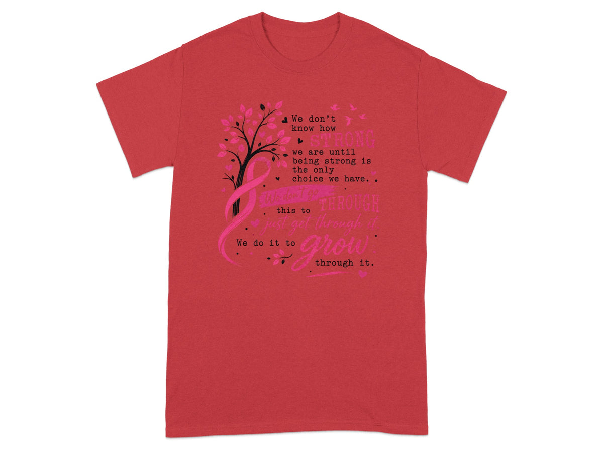 Red t-shirt with a pink ribbon, tree, and inspirational text about being strong and growing.