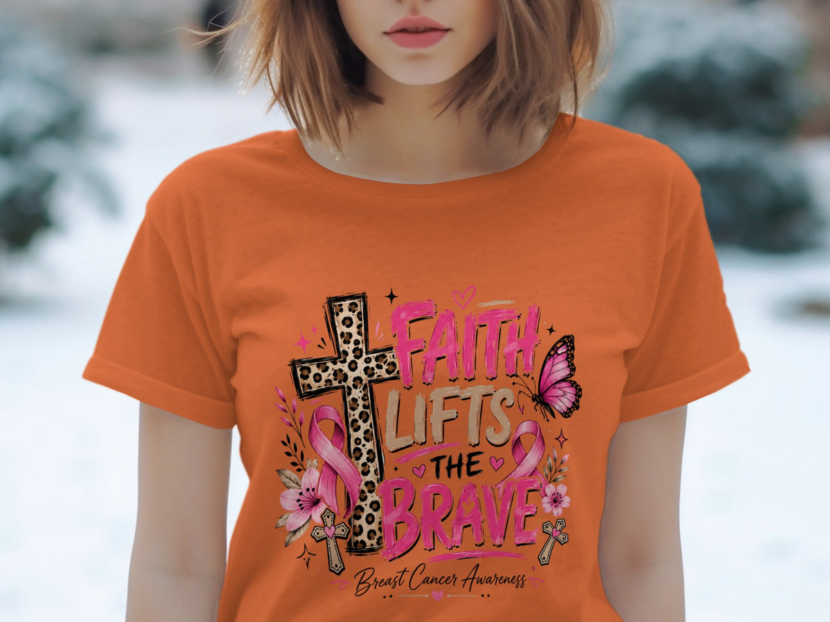 Orange t-shirt with "Faith Lifts The Brave" and breast cancer awareness graphic.