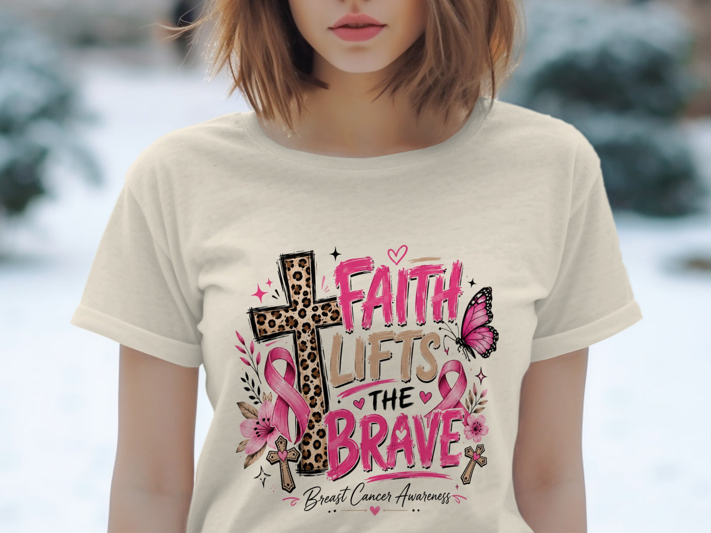 T-shirt with "Faith Lifts the Brave" breast cancer awareness graphic.