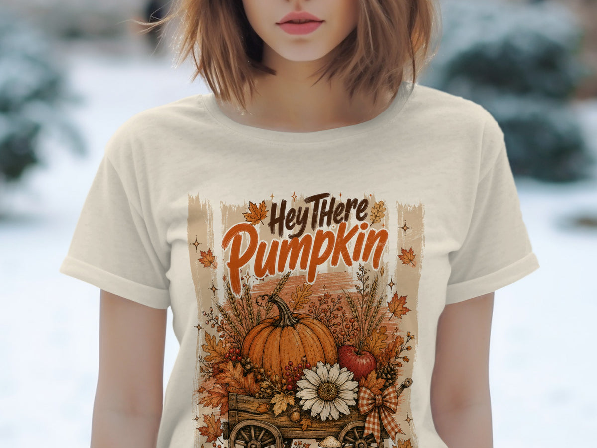 Cream t-shirt with "Hey There Pumpkin" text and autumn harvest cart graphic.