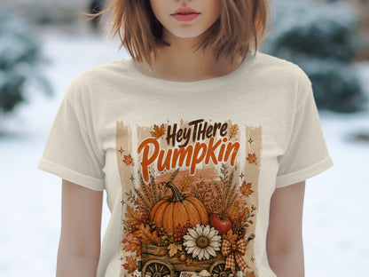 Cream t-shirt with "Hey There Pumpkin" text and autumn harvest cart graphic.
