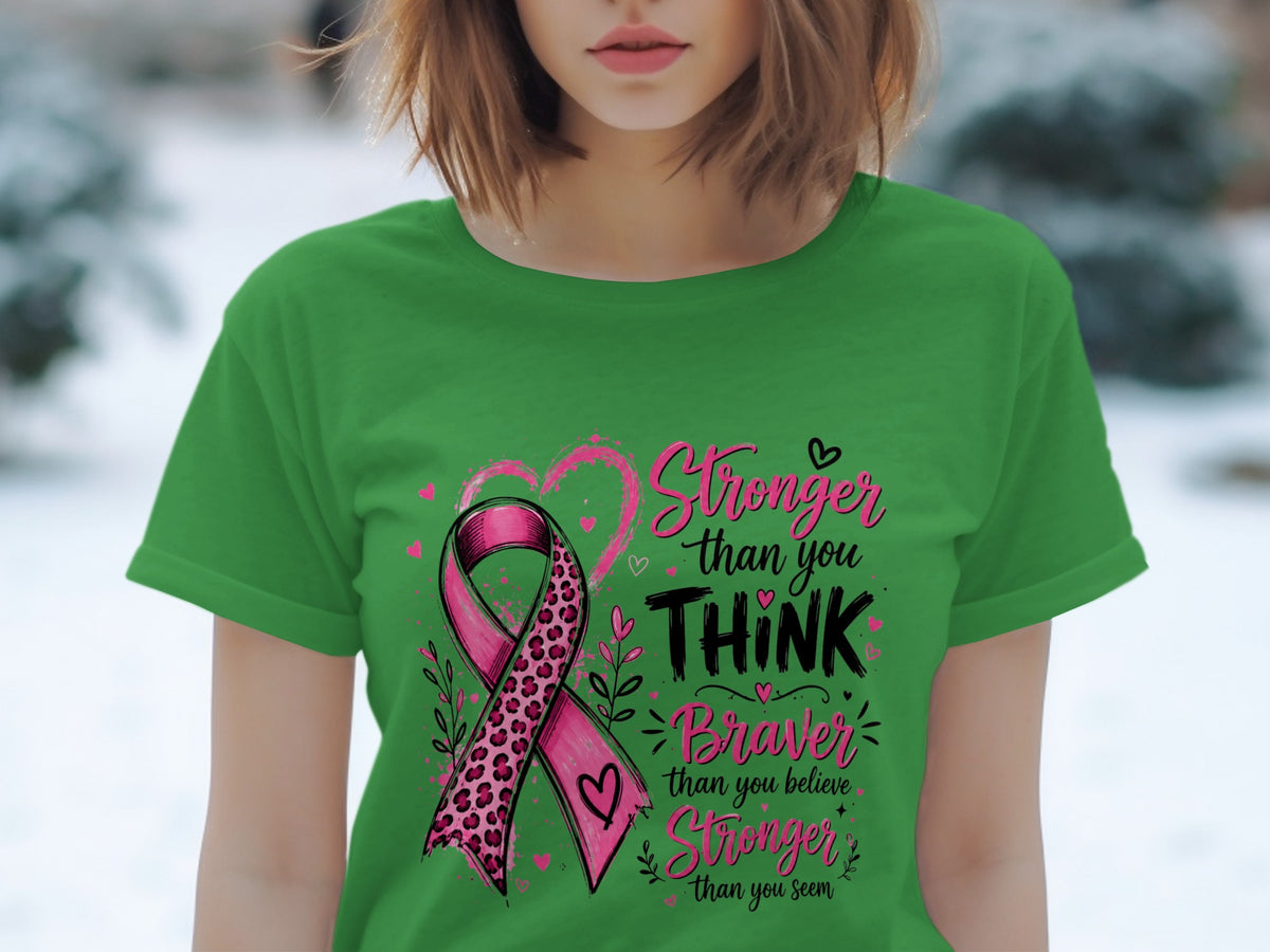 Green t-shirt with pink leopard print breast cancer ribbon and inspirational text.