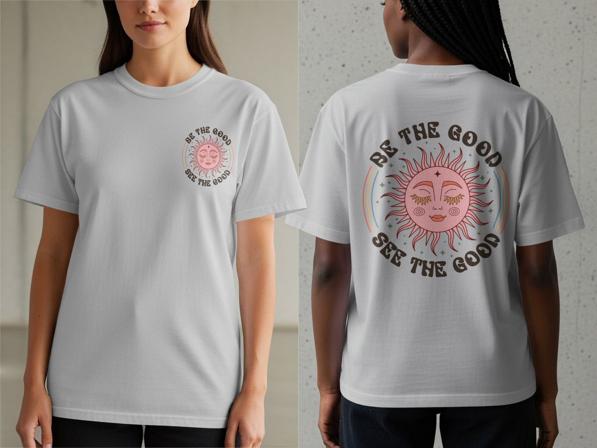 Grey t-shirt with a pink sun graphic and text "BE THE GOOD SEE THE GOOD."