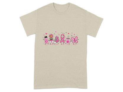 Tan t-shirt with a colorful cartoon graphic of breast cancer awareness symbols walking together.