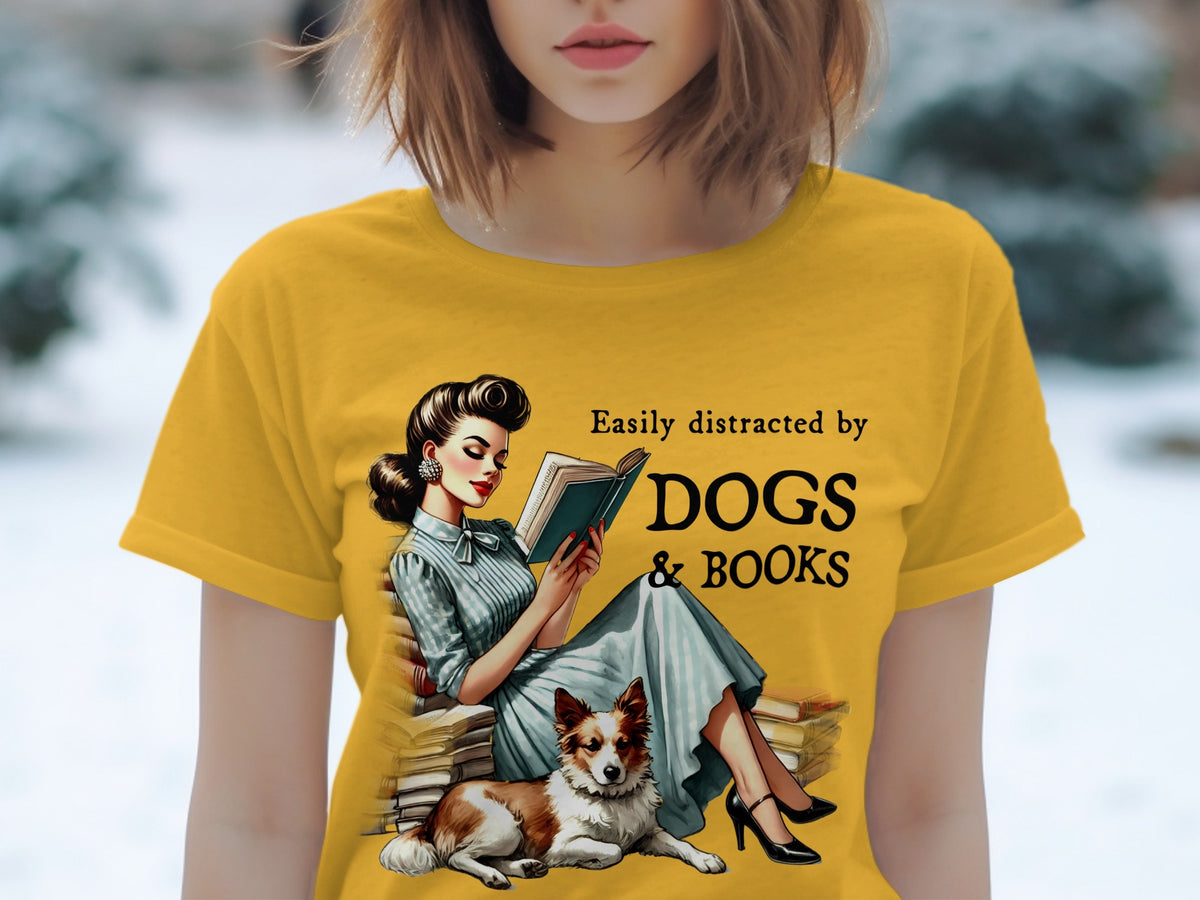 Yellow t-shirt with vintage woman reading a book and dog, text "Easily distracted by DOGS & BOOKS".