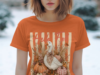 White goose with bow surrounded by pumpkins and fall foliage, text reads "Hello Fall".