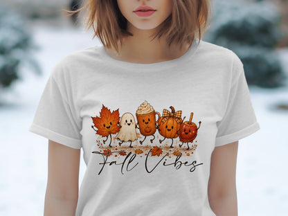 Cute cartoon fall characters and "Fall Vibes" text printed on a white t-shirt.