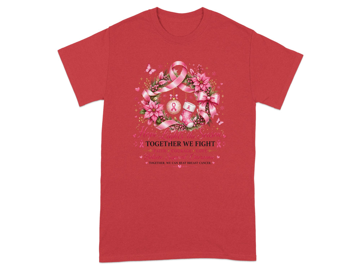 Red t-shirt with a pink wreath design featuring breast cancer ribbons and the text "Hope Lights the Season."