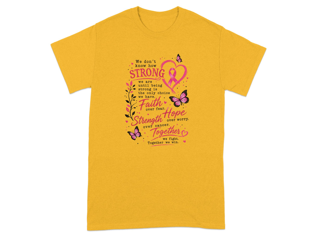 Yellow t-shirt with pink ribbon graphic and text: "Faith over fear, Strength over cancer, Hope over worry, Together we fight."