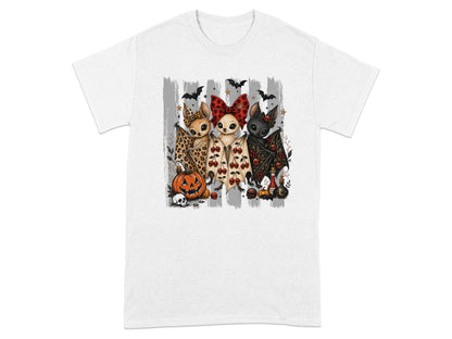 Three cartoon bats with Halloween decorations and a pumpkin.