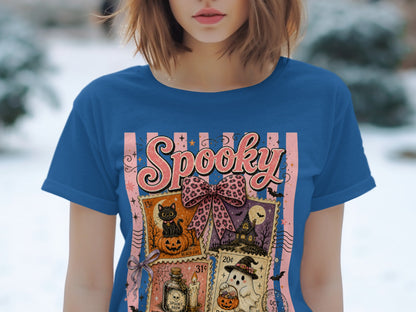 Blue t-shirt with "Spooky" text and Halloween-themed postage stamps.