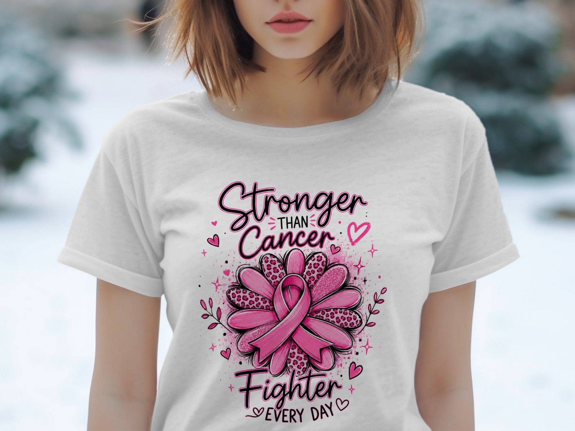 White t-shirt with "Stronger Than Cancer Fighter Every Day" and pink ribbon flower design.
