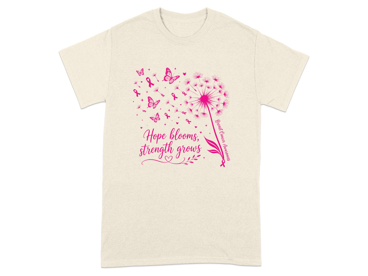 Cream t-shirt with pink dandelion, butterflies, ribbons, and text "Hope blooms, strength grows."