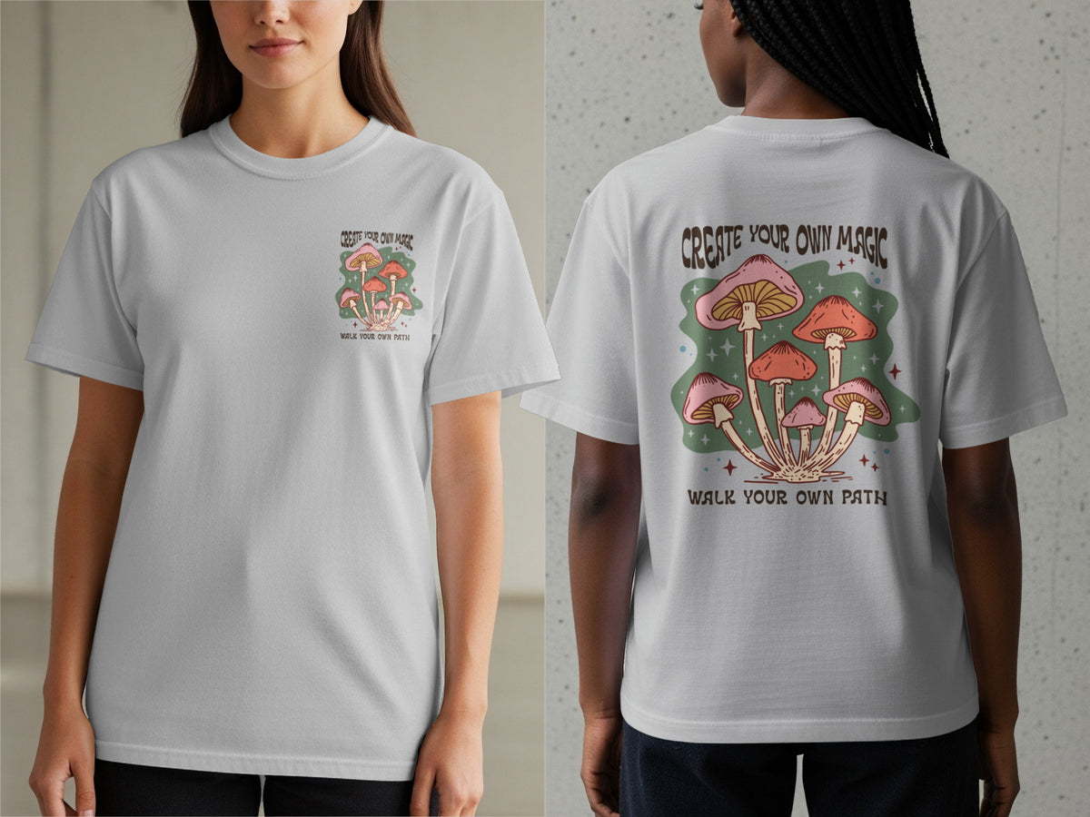 Light grey t-shirt with mushrooms and text "CREATE YOUR OWN MAGIC WALK YOUR OWN PATH".