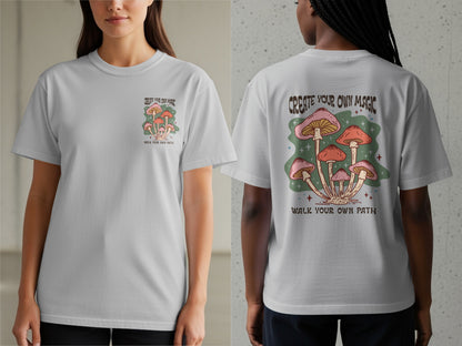 Light grey t-shirt with mushrooms and text "CREATE YOUR OWN MAGIC WALK YOUR OWN PATH".
