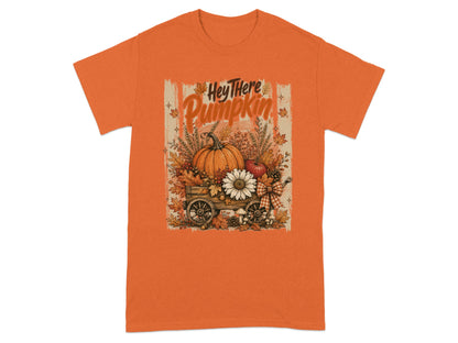 Orange t-shirt with "Hey There Pumpkin" text and autumn harvest cart illustration.