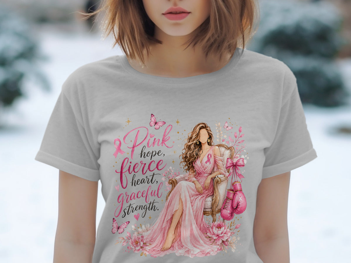 T-shirt graphic: woman in pink dress, boxing gloves, text "Pink hope, fierce heart, graceful strength".