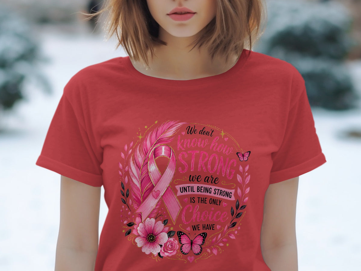 Red t-shirt with breast cancer ribbon, feathers, flowers, butterflies, and text.