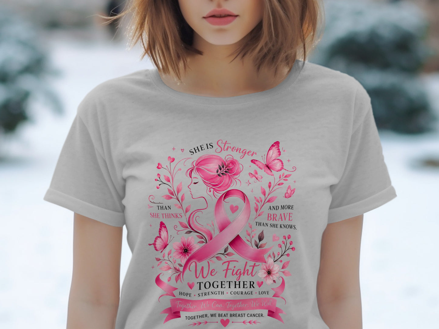 Pink breast cancer ribbon with "She is Stronger" and "We Fight Together" text.