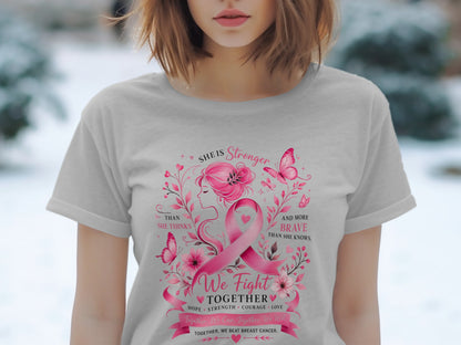 Pink breast cancer ribbon with "She is Stronger" and "We Fight Together" text.