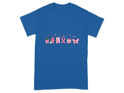 Cute pink ribbon, shoe, journal, coffee cup, and butterfly graphic on a blue t-shirt.