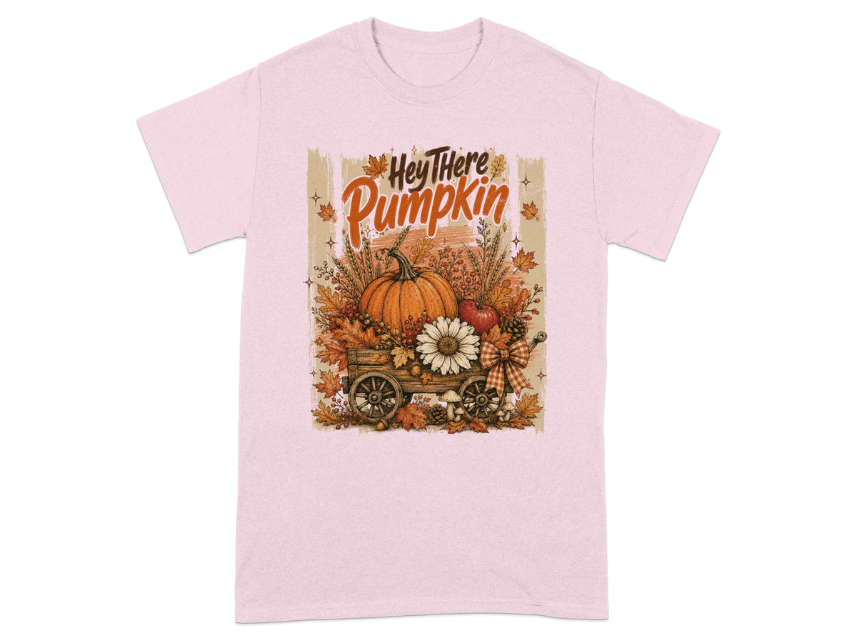 Pink t-shirt with "Hey There Pumpkin" graphic featuring a wagon full of autumn harvest.
