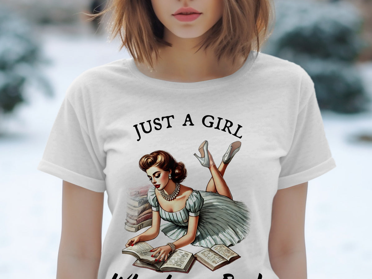 White t-shirt with "JUST A GIRL" text and illustration of a woman reading books.