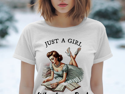 White t-shirt with "JUST A GIRL" text and illustration of a woman reading books.
