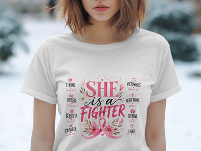 White t-shirt with "She is a Fighter" and positive words in pink lettering.