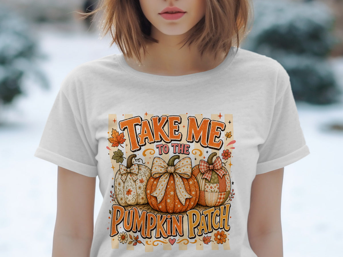 White t-shirt with "Take Me To The Pumpkin Patch" graphic featuring three decorated pumpkins.