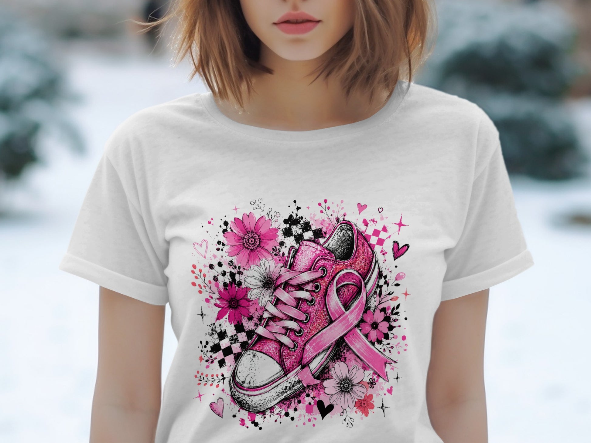 Pink sneaker with breast cancer ribbon surrounded by flowers and hearts.