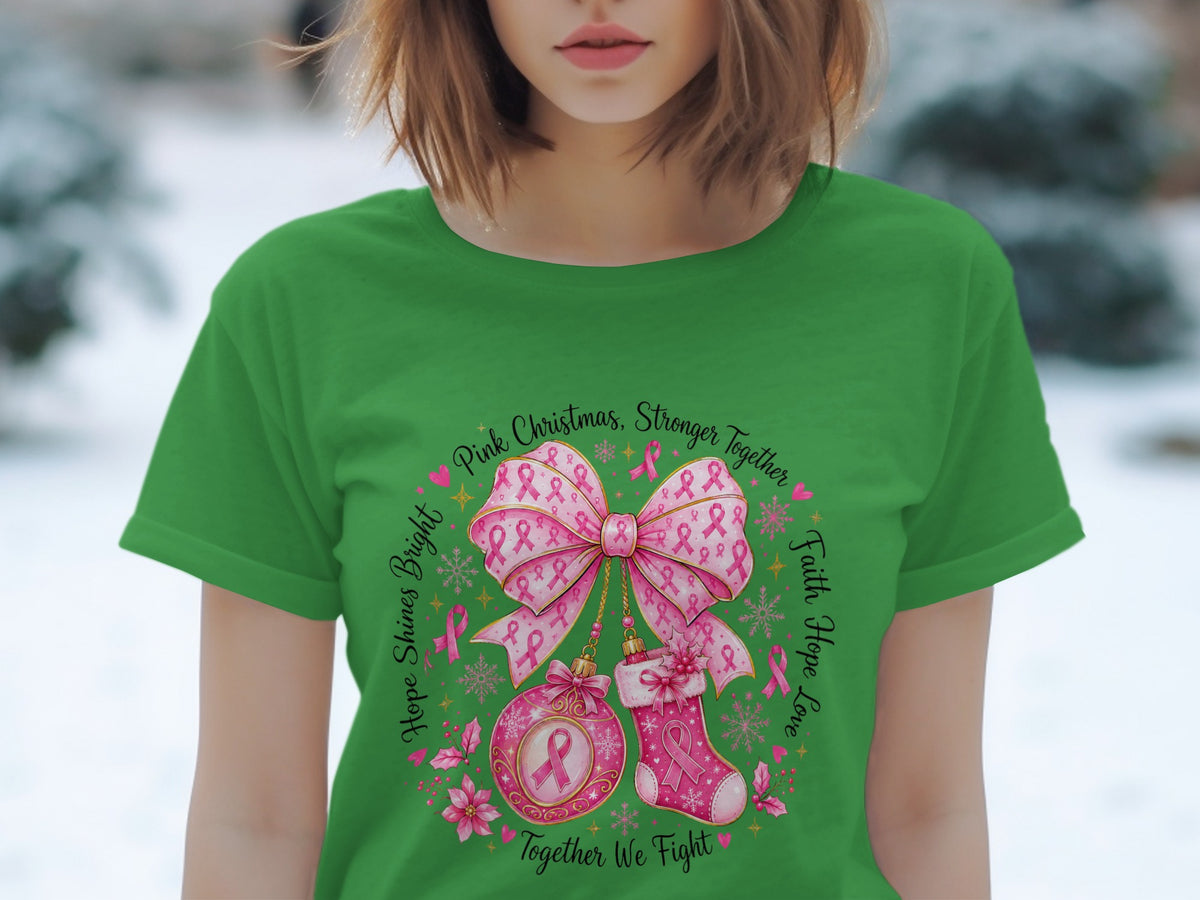 Green t-shirt with pink breast cancer awareness holiday graphic and text.