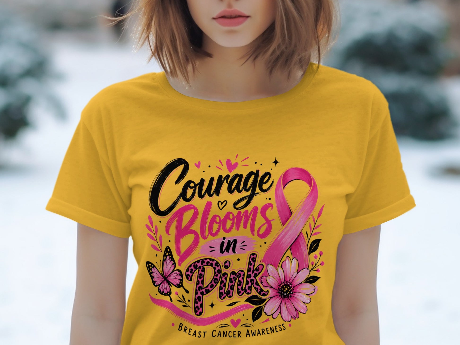 Yellow t-shirt with "Courage Blooms in Pink" and breast cancer awareness ribbon.